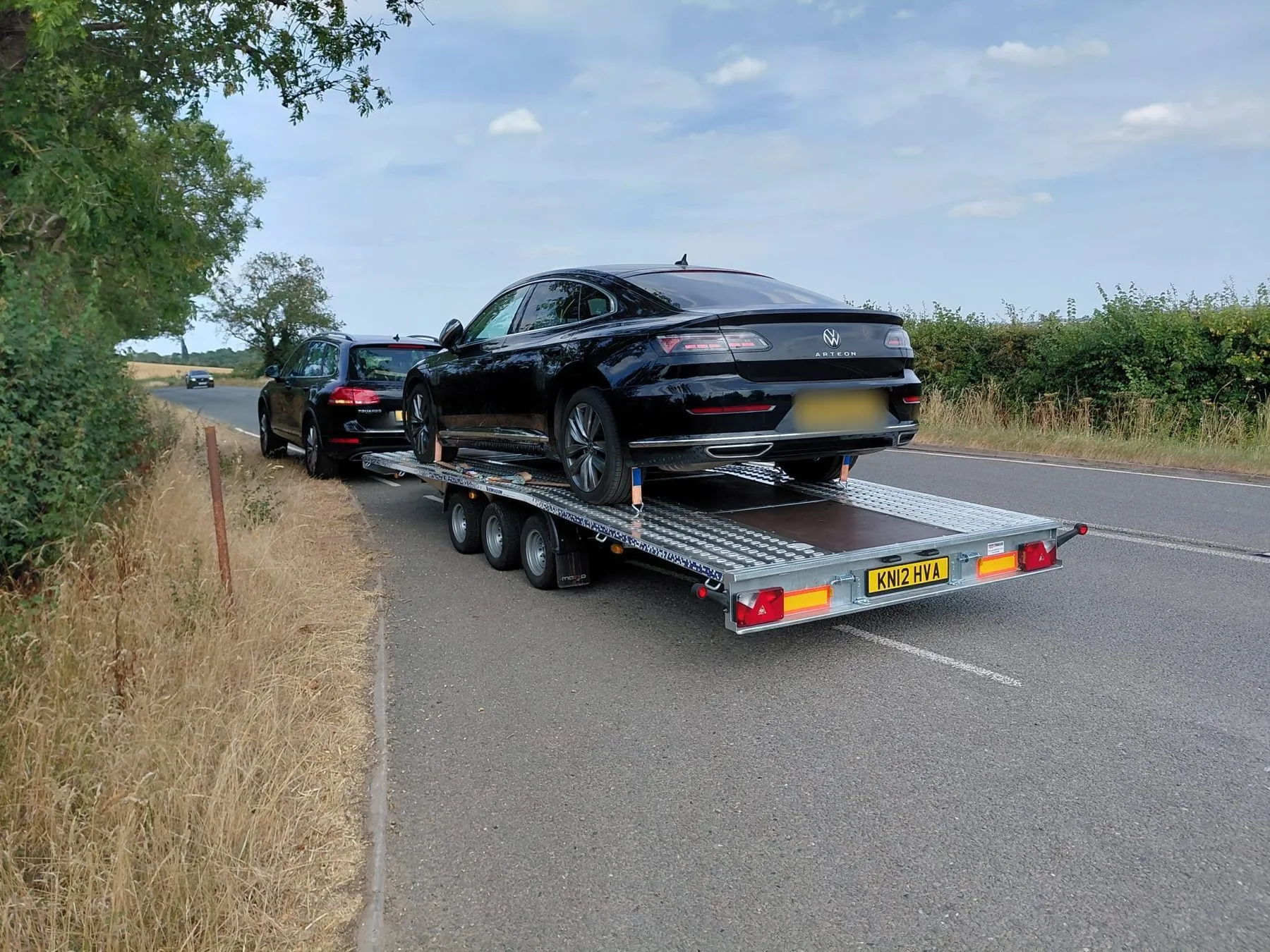 VP Autos transporter on a Northamptonshire country road with a car loaded